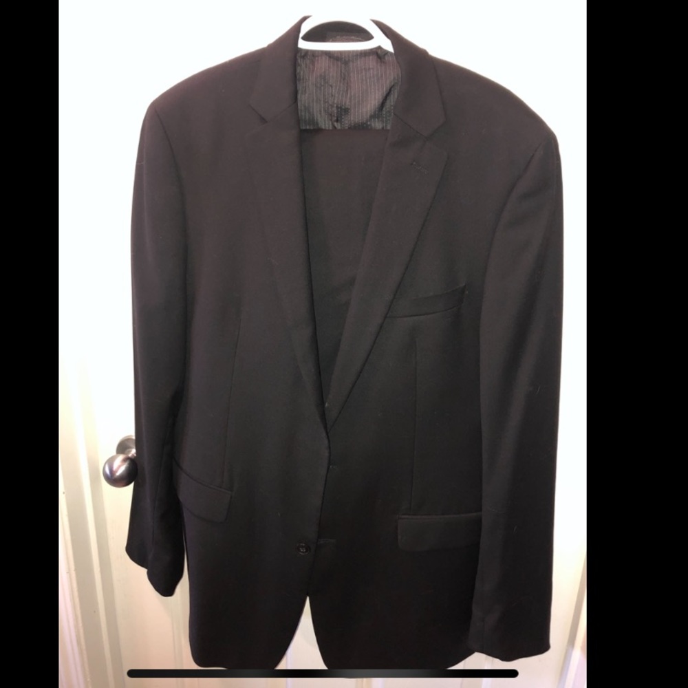 Charcoal black Calvin Klein suit.
